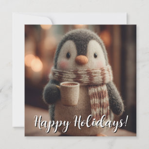 Süße gestrickte Pinguin-Puppe mit Schal und Tasse Feiertagskarte