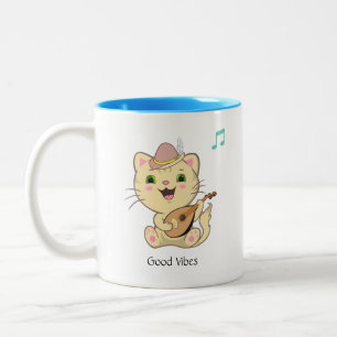 Süße glückliche musikalische rote getigerte Katze  Zweifarbige Tasse