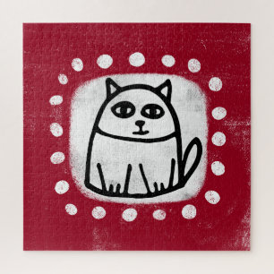 Süße Katze auf rotem Puzzle