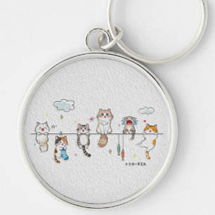 Süße Katzen hängen an einem Schlüsselanhänger