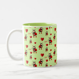 Süße Marienkäfer, Herzen und Freudetext auf Hellgr Zweifarbige Tasse