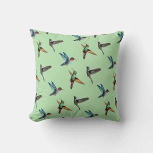 Süße mehrfarbige Kolibris auf olivgrün Kissen