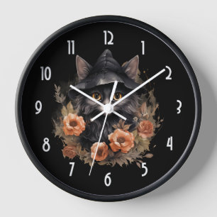 Süße schwarze Katze in einem Hexenhut Uhr