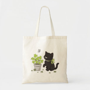 Süße schwarze Katze und vierblättriges Kleeblatt-T Tragetasche