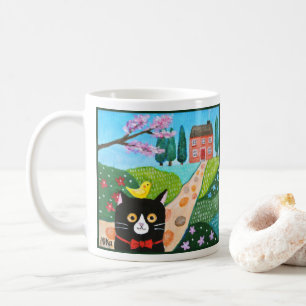 Süße Tuxedo-Katze und gelber Vogel in der Country- Kaffeetasse