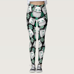Süße und verspielte Katze schaut aus einer Tasche Leggings