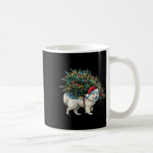 Süßer Amerikanischer Eskimo-Hund in einem Weihnach Kaffeetasse