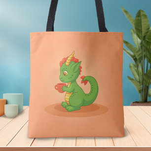 Süßer Baby-Drache hält Tasse auf Orange Tasche
