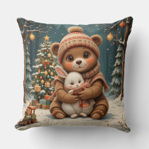 Süßer Bär hält Hasen neben dem Weihnachtsbaum Kissen