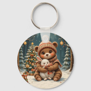 Süßer Bär hält Hasen neben dem Weihnachtsbaum Schlüsselanhänger