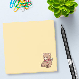 Süßer beiger Teddybär mit gestreifter gelber Schär Post-it Klebezettel
