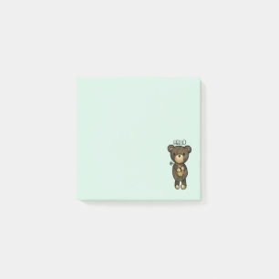 Süßer brauner Bär hält eine gelbe Blume Post-it Klebezettel