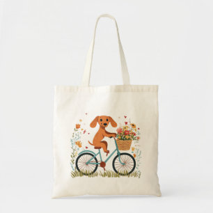 Süßer Dachshund Hund beim Radfahren mit Frühlingsb Tragetasche