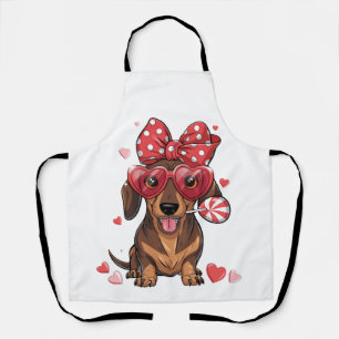 Süßer Dachshund mit Herzbrille und Polka-Punkten Schürze