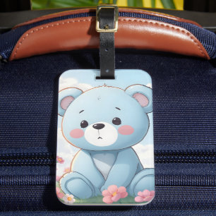 Süßer kleiner blauer Teddybär im Garten Gepäckanhänger