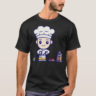 Süßer Kochjunge beim Kochen in der Küche Cartoon T-Shirt