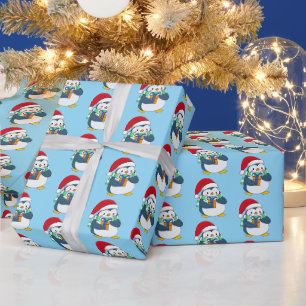 Süßer Pinguin in Weihnachtsmütze Geschenkpapier