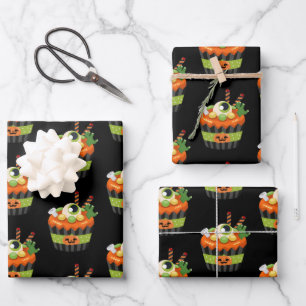 Süßer und gruseliger Halloween-Cupcake mit einem g Geschenkpapier Set