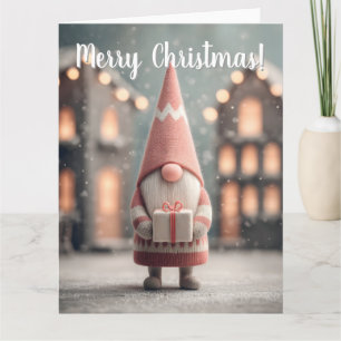 Süßer Weihnachts-Gnom mit einer Geschenkschachtel Karte