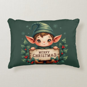 Süßer Weihnachtself hält fröhliches Schild in Grün Dekokissen