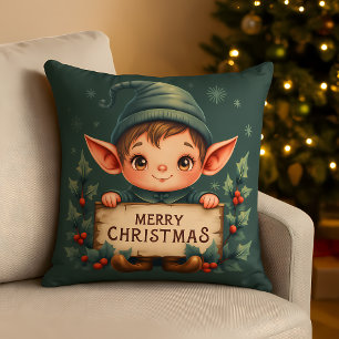 Süßer Weihnachtself hält fröhliches Schild in Grün Kissen