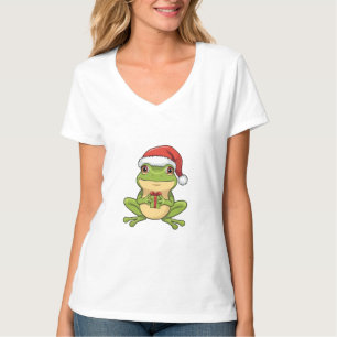 Süßer Weihnachtsfrosch mit Santa-Hut hält Geschenk T-Shirt