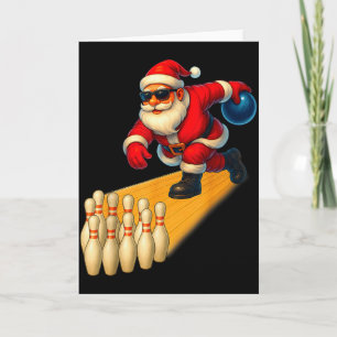 Süßer Weihnachtsmann spielt Bowlingkugel und Pins Karte