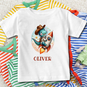 Süßer Weltraum-Cowboy-Trex auf einer Weltraumraket Baby T-shirt
