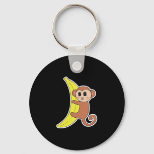 süßes Babyäffchen auf Banane Schlüsselanhänger