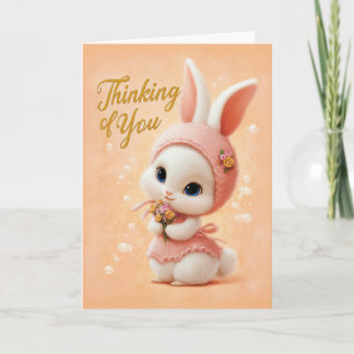 Süßes Babykaninchen im Pfirsichkleid, das an dich Karte