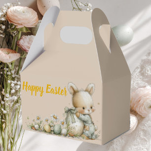 Süßes Babykaninchen in Schlafanzug mit einem Oster Geschenkschachtel