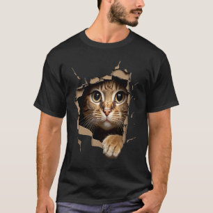 Süßes Kätzchen schaut aus zerrissenem Stoff Katze T-Shirt