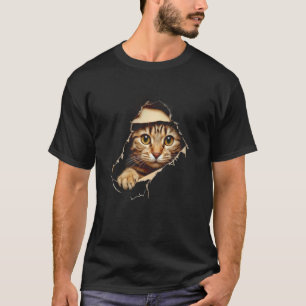 Süßes Kätzchen schaut aus zerrissenem Stoff Katzen T-Shirt