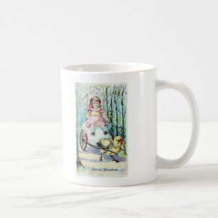 Süßes Oster Mädchen im Wagen mit Küken, das den Wa Kaffeetasse