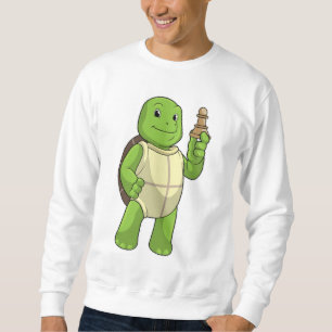 Sweatshirt Tortue jouant aux échecs avec le pion de l'échiqui