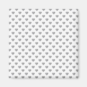 Symmetrische kleine Betonherzen auf Weiß Magnet