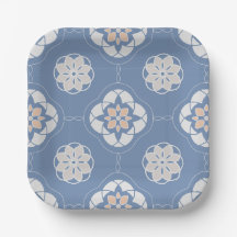 Symmetrisches Orange-Blume-Muster auf blau