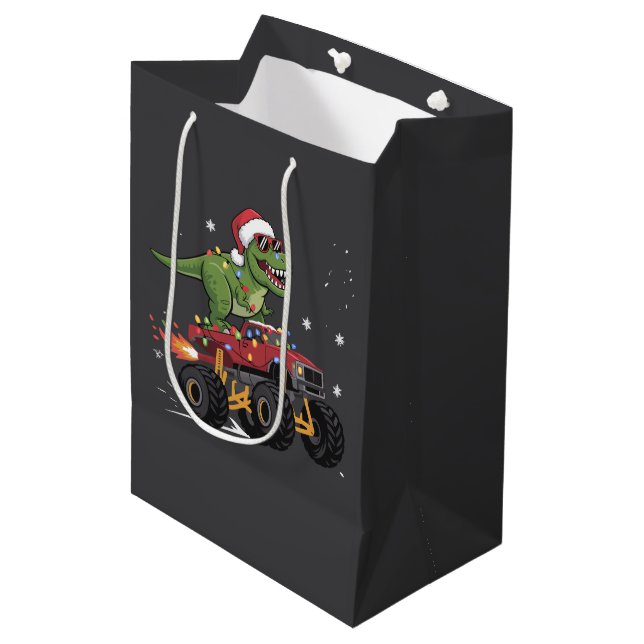 T-Rex Dinosaur Weihnachtsmonster Truck Mittlere Geschenktüte (Vorderseite Schrägansicht)
