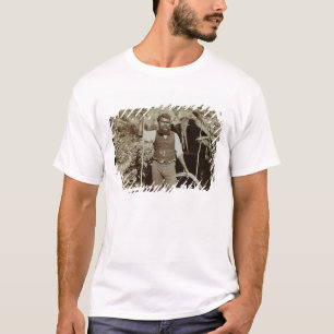 T-shirt Aborigène avec un boomerang, c.1860s (photo de