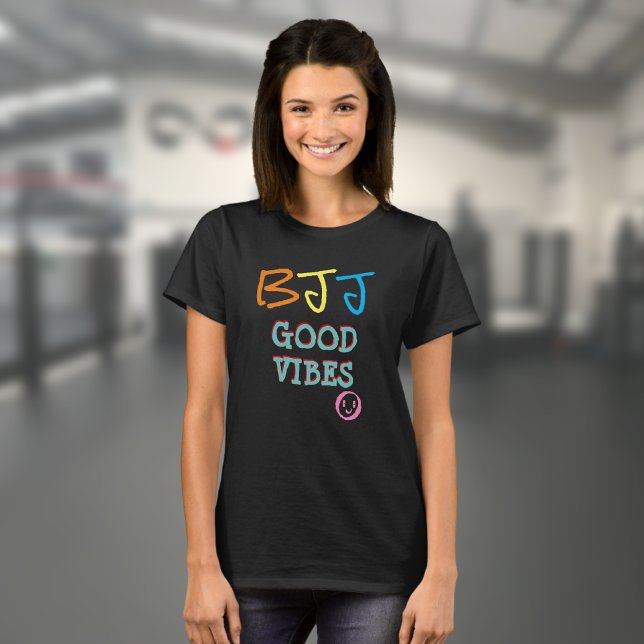 T-shirt BJJ Retro Graffiti style Good Vibes Black (Black BJJ Good Vibes T shirt worn by a female model in a gym)