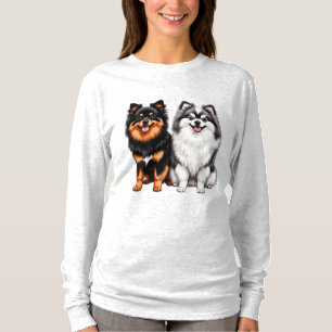 T-shirt Deux chiens heureux et duveteux assis côte à côte