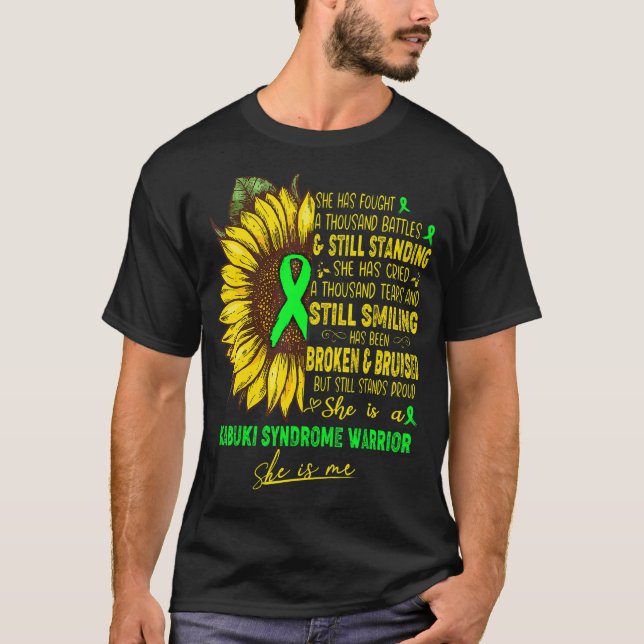 T-shirt Elle Est Une Guerrière Du Syndrome Kabuki Elle Est (Devant)