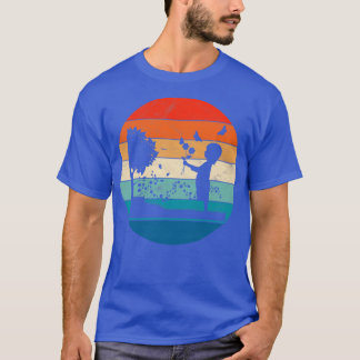 T-shirt Fille avec des fleurs dans un jardin