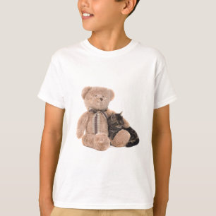 T-shirt kitten in the arms of a teddy bear