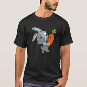 T-shirt Le lapin mignon porte un gros lapin de carotte