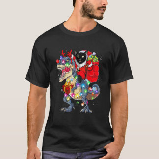 T-shirt Père Noël Chat Noir à Cheval sur un Dinosaure rex 