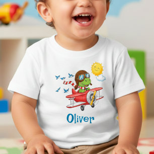 T-shirt Pour Bébé Joli pilote dinosaure volant dans un avion rouge