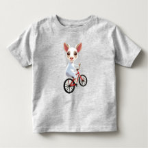 Jolie petite chèvre blanche sur une bicyclette
