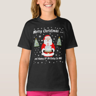 T-shirt Santa tenant un gâteau d'anniversaire Joyeux Noël 