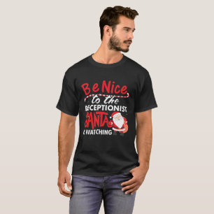 T-shirt Soyez Nice au réceptionniste que Père Noël observe